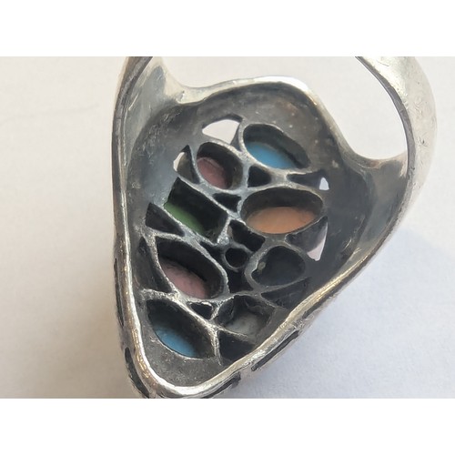 1149 - A retro style 925 silver ring set with a large number of multi-coloured cabochon stones, possibly Am... 