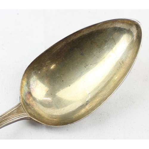 1099 - A Georgian silver basting spoon with thread border and engraved crest, marked for London 1790 by Pet... 