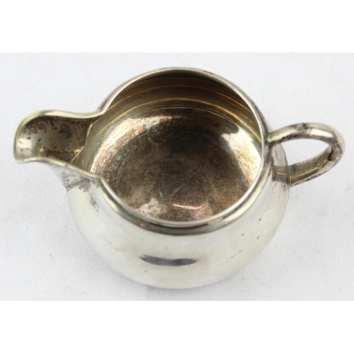 1099I - A Danish silver cream jug, marked to base and XRF confirmed, approx 12cm wide, approx 89.26g gross