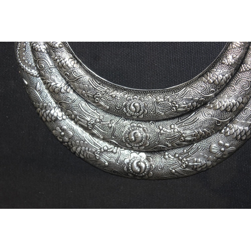 1099Y - 4 deep framed silver coloured ethnic jewellery display pieces, possibly Vietnamese, sealed in frames... 