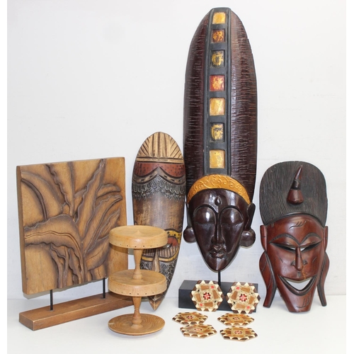 1586 - Qty of various African and other African style woodenware items to include facemasks and a set of 6 ... 