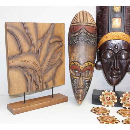 1586 - Qty of various African and other African style woodenware items to include facemasks and a set of 6 ... 