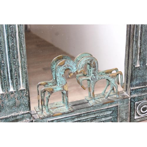 471 - Large highly decorative copper effect wooden wall mirror, decorated with metal Etruscan horses, appr... 