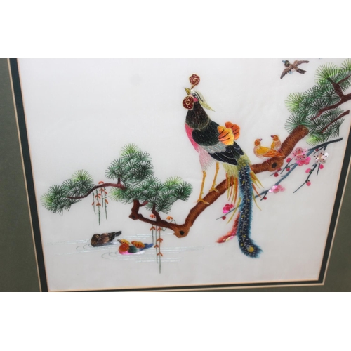 475 - Highly decorative Japanese silk embroidered framed picture of a peacock and other birds, approx 62cm... 