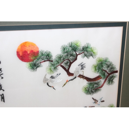 475 - Highly decorative Japanese silk embroidered framed picture of a peacock and other birds, approx 62cm... 