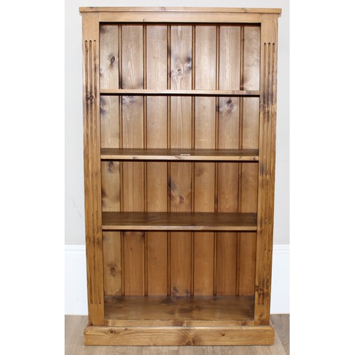 182 - A modern stained pine adjustable bookcase with 3 adjustable shelves, approx 81cm wide x 32cm deep x ... 