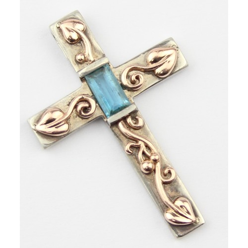 1105 - Clogau Welsh Gold & Silver, an Art Nouveau inspired silver and 9ct gold pendant crucifix set with ba... 