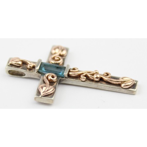 1105 - Clogau Welsh Gold & Silver, an Art Nouveau inspired silver and 9ct gold pendant crucifix set with ba... 