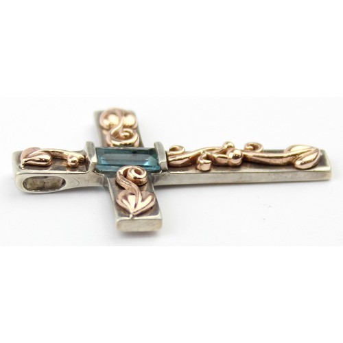 1105 - Clogau Welsh Gold & Silver, an Art Nouveau inspired silver and 9ct gold pendant crucifix set with ba... 