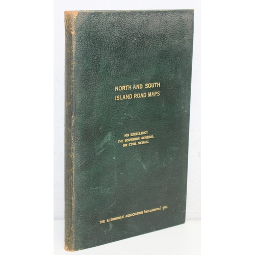 18 - A vintage leather bound New Zealand road map set showing both the North & South Islands, the gilt to... 