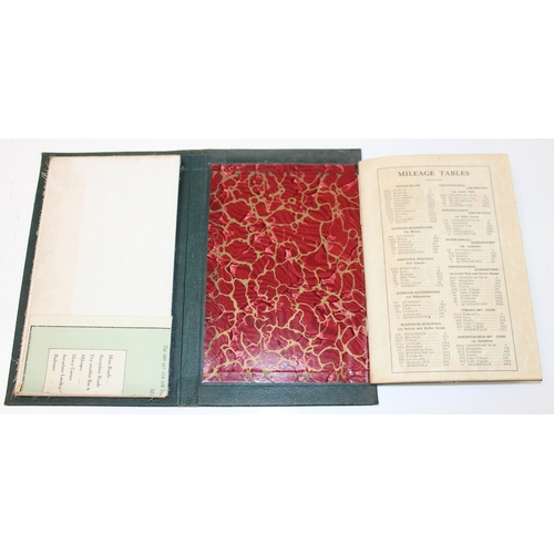 18 - A vintage leather bound New Zealand road map set showing both the North & South Islands, the gilt to... 