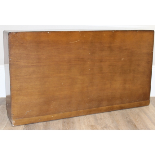 37 - A mid-century retro glazed 2 door bookcase, seemingly unmarked, approx 136cm wide x 27cm deep x 75cm... 