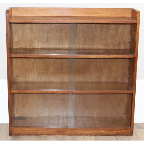 38 - A mid-century retro glazed 2 door bookcase, seemingly unmarked, approx 91cm wide x 22cm deep x 92cm ... 