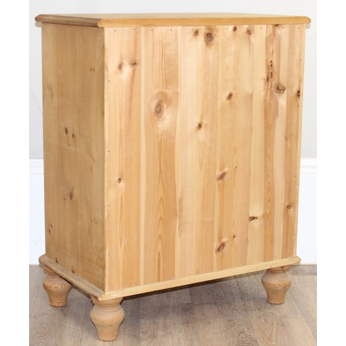 51 - A modern solid pine four drawer chest of drawers with turned handles and bun feet, approx 66cm wide ... 