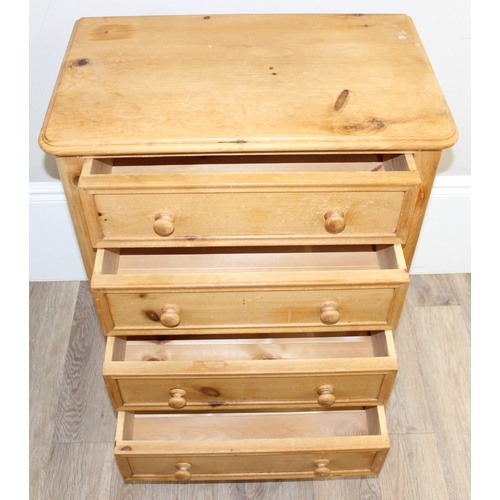 50 - A modern solid pine four drawer chest of drawers with turned handles and bun feet, approx 66cm wide ... 