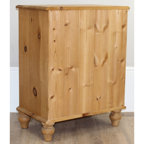 50 - A modern solid pine four drawer chest of drawers with turned handles and bun feet, approx 66cm wide ... 