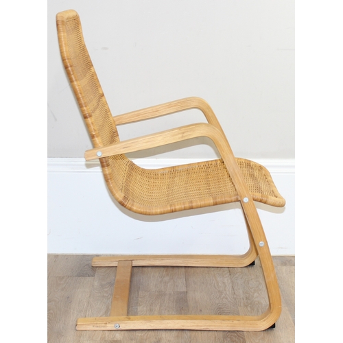 83 - A Scandinavian designed wicker chair with bentwood cantilever base, approx 58cm wide x 88cm tall