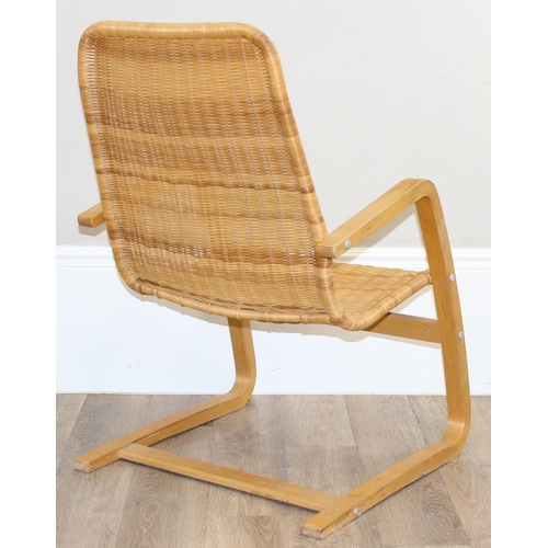 83 - A Scandinavian designed wicker chair with bentwood cantilever base, approx 58cm wide x 88cm tall