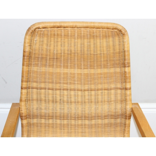 83 - A Scandinavian designed wicker chair with bentwood cantilever base, approx 58cm wide x 88cm tall