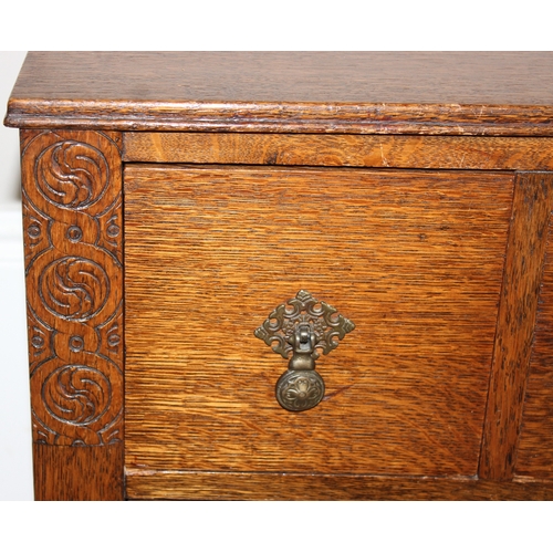 116 - An early 20th century oak 3 over 1 low chest of drawers or sideboard with Queen Anne style brass dro... 