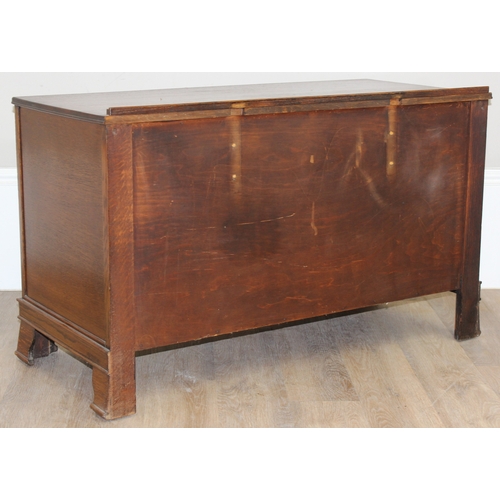 116 - An early 20th century oak 3 over 1 low chest of drawers or sideboard with Queen Anne style brass dro... 