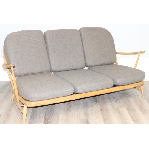 26 - A retro Ercol model 203 3 seater sofa with blonde finish and grey upholstery, black and gold label, ... 