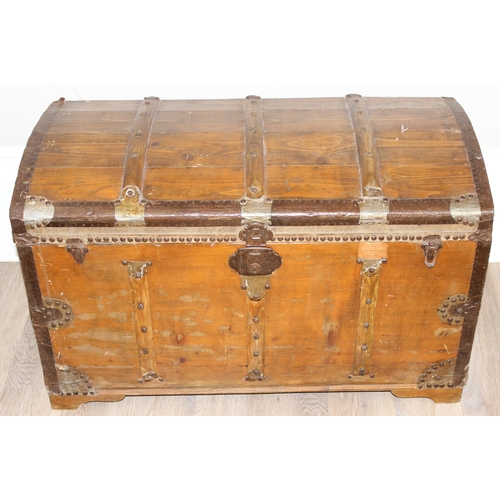 6 - An antique stained pine dome-topped chest or trunk with metal banding, approx 95cm x 49cm x 56cm