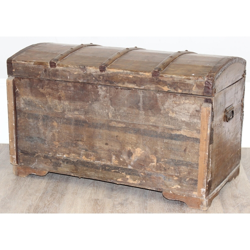 6 - An antique stained pine dome-topped chest or trunk with metal banding, approx 95cm x 49cm x 56cm