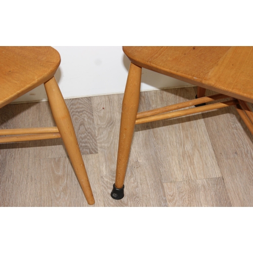 25 - 2 retro blonde Ercol model 306 candlestick dining chairs, partial labels to back, approx 43cm wide x... 