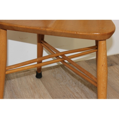 25 - 2 retro blonde Ercol model 306 candlestick dining chairs, partial labels to back, approx 43cm wide x... 