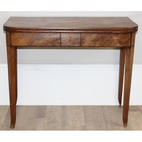 112 - A 19th century mahogany tea table with fold over top and inlaid details, approx 91cm wide x 45cm dee... 