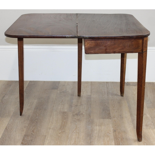 112 - A 19th century mahogany tea table with fold over top and inlaid details, approx 91cm wide x 45cm dee... 