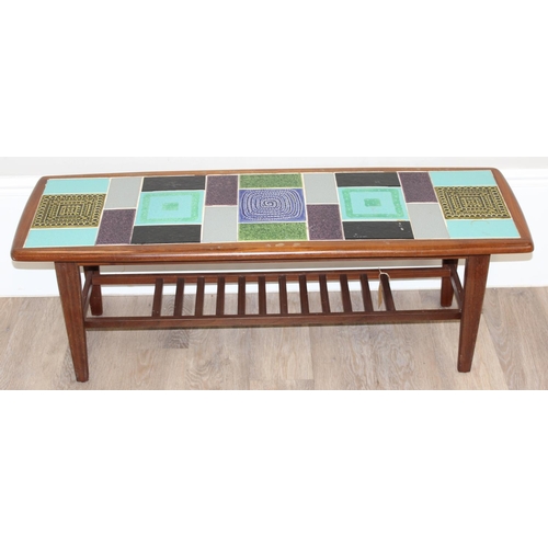 89 - A retro teak and tile topped coffee table, seemingly unmarked but likely retailed by Heals, the tile... 