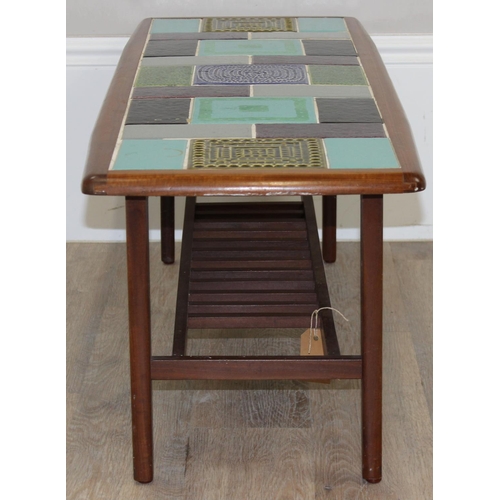 89 - A retro teak and tile topped coffee table, seemingly unmarked but likely retailed by Heals, the tile... 