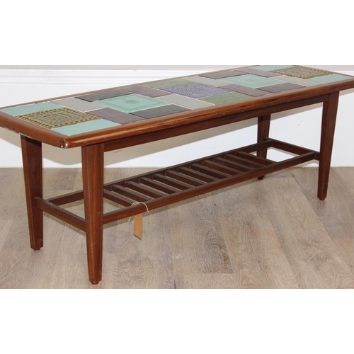 89 - A retro teak and tile topped coffee table, seemingly unmarked but likely retailed by Heals, the tile... 