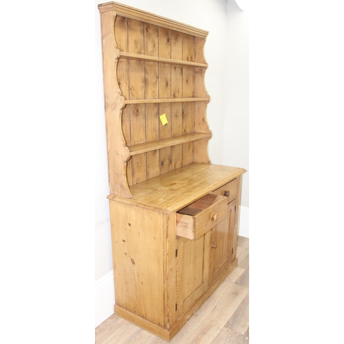 10 - A 19th century pine dresser with plate rack, 2 drawers over a cupboard, approx 109cm wide x 52cm dee... 