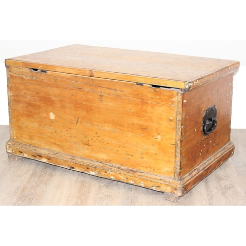 11 - An antique pine trunk with rope handles, approx 94cm wide x 56cm deep x 48cm tall