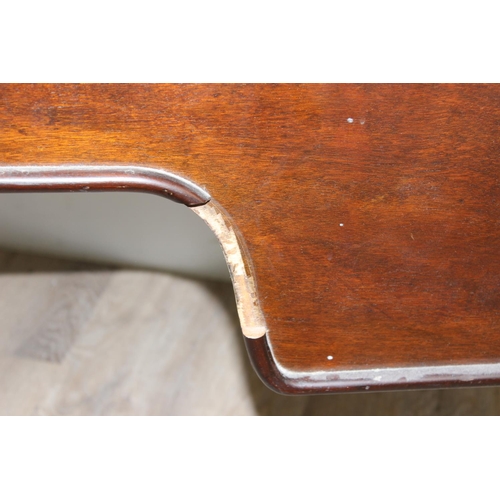 109 - An early 20th century walnut desk with cabriole legs and distressed leather top, the desk drawers wi... 