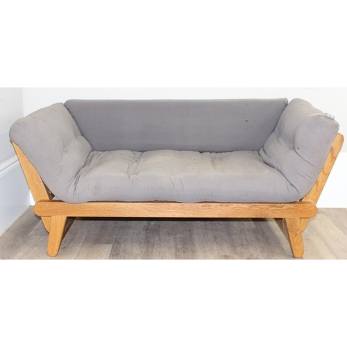 54 - A modern light oak futon sofa or sofa bed with drop arms and grey upholstered cushions by the Futon ... 