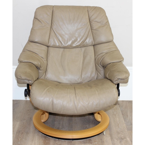 75 - A retro Ekornes of Norway Stressless reclining armchair, beige leather upholstery and wooden base, a... 