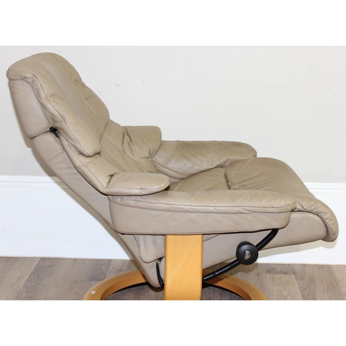 75 - A retro Ekornes of Norway Stressless reclining armchair, beige leather upholstery and wooden base, a... 