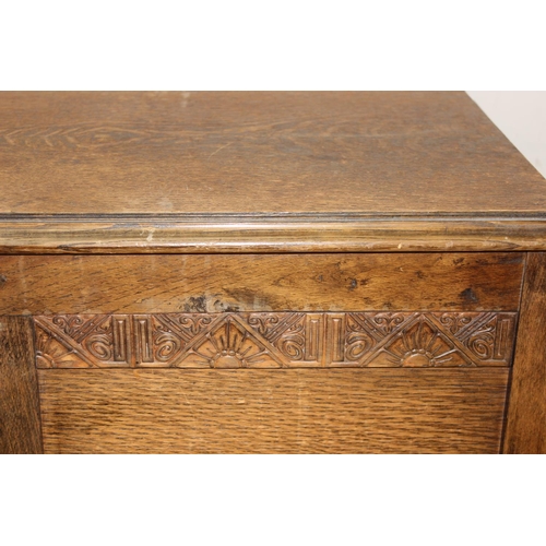 198Y - A 1930's Art Deco period oak blanket box containing a number of vintage blankets, approx 92cm x 44cm... 