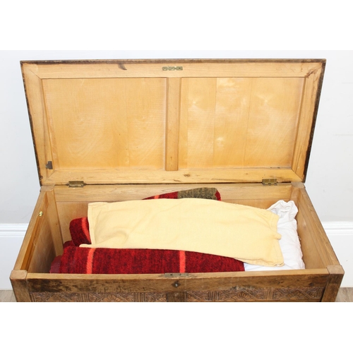 198Y - A 1930's Art Deco period oak blanket box containing a number of vintage blankets, approx 92cm x 44cm... 