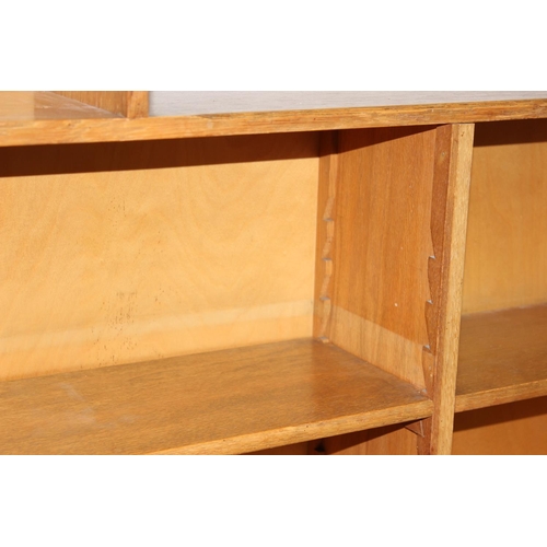 81 - A mid-century light oak bookcase with stepped top and adjustable shelves, approx 121cm x 20cm x 118c... 