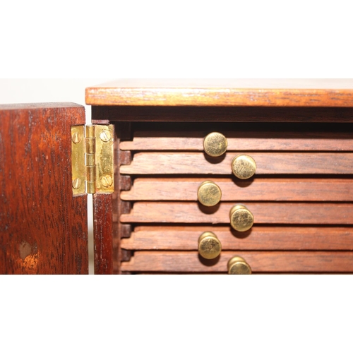 284 - Vintage mahogany collectors' 14-drawer coin or medal box with lockable doors and key, approx 29cm x ... 