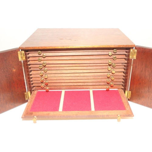 284 - Vintage mahogany collectors' 14-drawer coin or medal box with lockable doors and key, approx 29cm x ... 