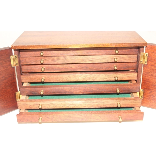 285 - Vintage mahogany 7-drawer collectors' box with lockable doors and key, approx 29cm x 30cm x 18cm