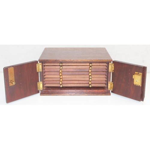 286 - Small vintage mahogany 8-drawer collectors' coin box with lockable doors and key, approx 21cm x 17cm... 