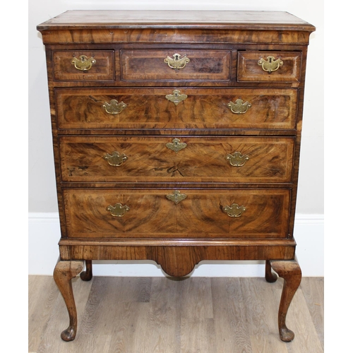 198T - An early 18th century 3 over 3 walnut chest on stand with Georgian brass handles and cabriole legs, ... 