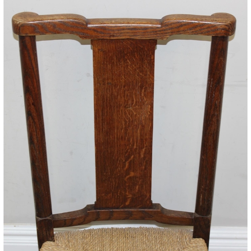 86 - A pair of Arts & Crafts period oak and seagrass seated chairs in the manner of William Morris, each ... 